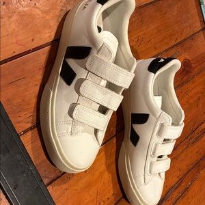 Veja white sneakers with Velcro strap.  Black V. Never been worn.
